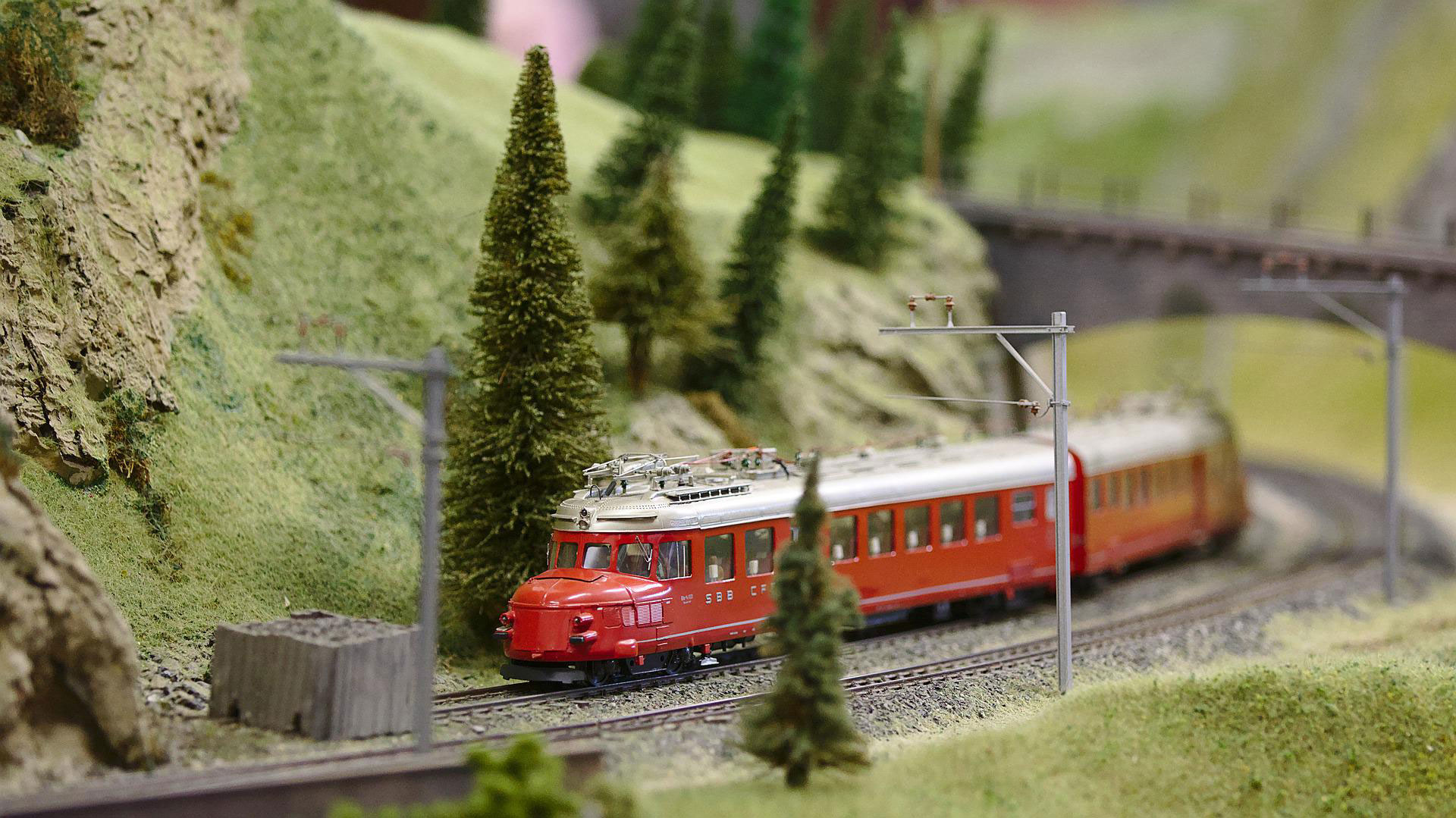 Model train on model train tracks on railway layout