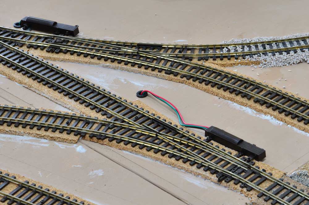 motors attached to model railway turnouts